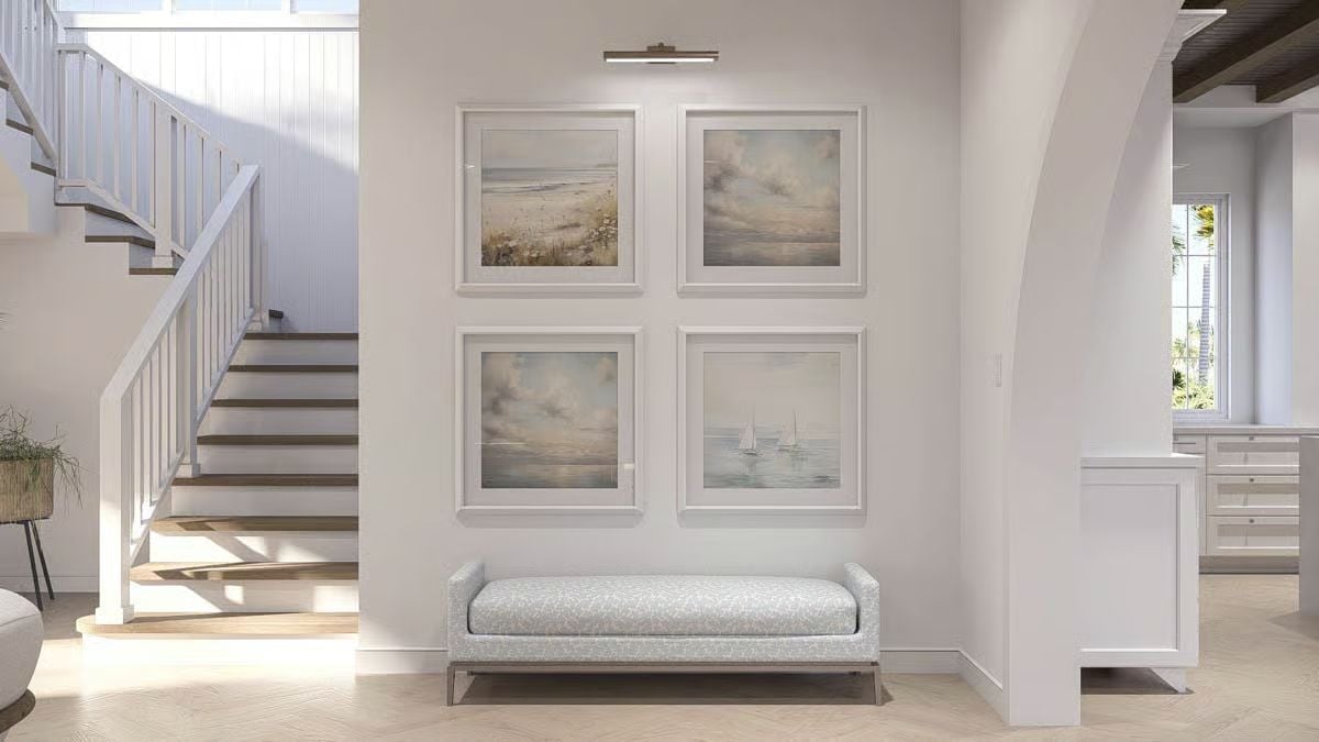 Soft Coastal Gallery Wall Anchors a Light-Filled Foyer with Upholstered Bench
