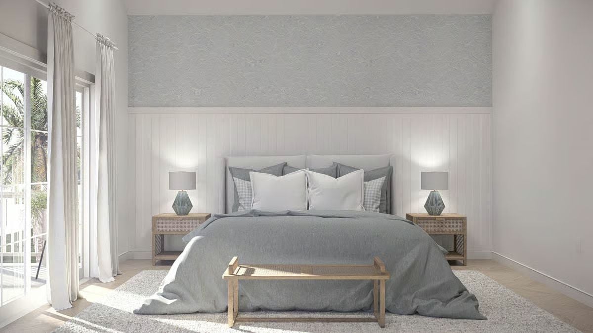 Layered Grey Linens and Vertical Paneling Give This Bedroom Its Coastal Calm
