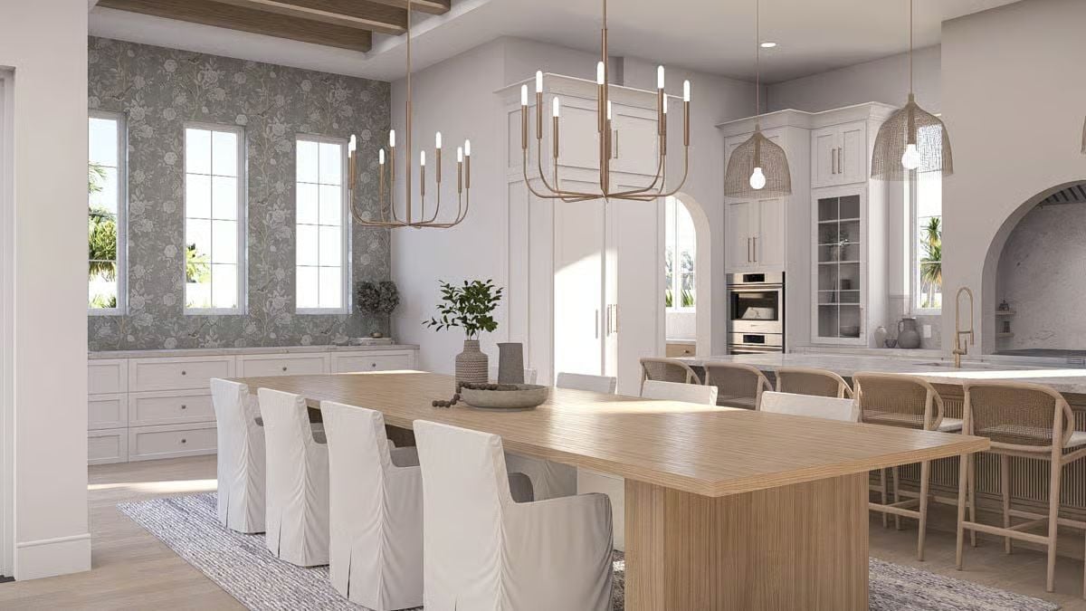 Gold Chandeliers and Natural Wood Pull a Dining Space into Coastal Focus
