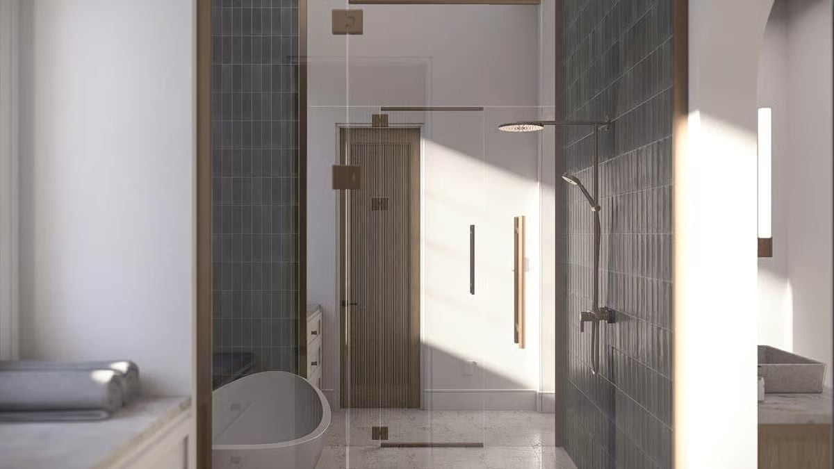 Warm Wood Frames and Dark Tile Give This Bathroom Its Coastal Edge