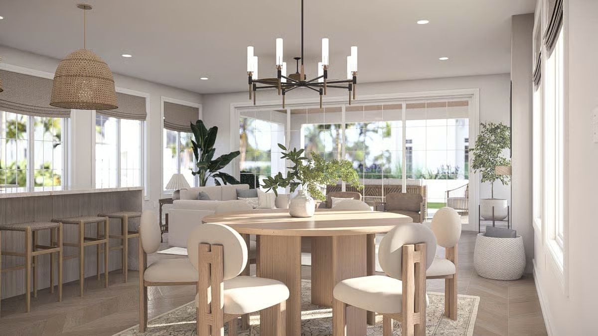 Warm Wood Tones and Boucle Seating Define an Open Coastal Dining Space