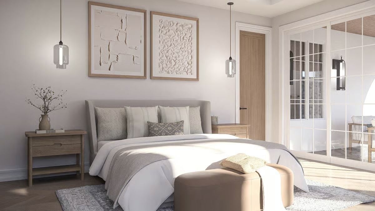 Pendant Lights and Layered Neutrals Shape a Serene Coastal Bedroom