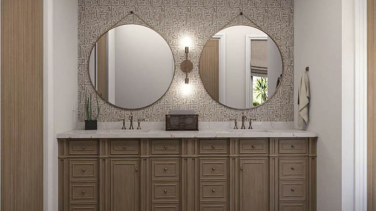 Double Vanity With Brass Fixtures and Geometric Wallpaper Sets a Confident Bathroom Tone