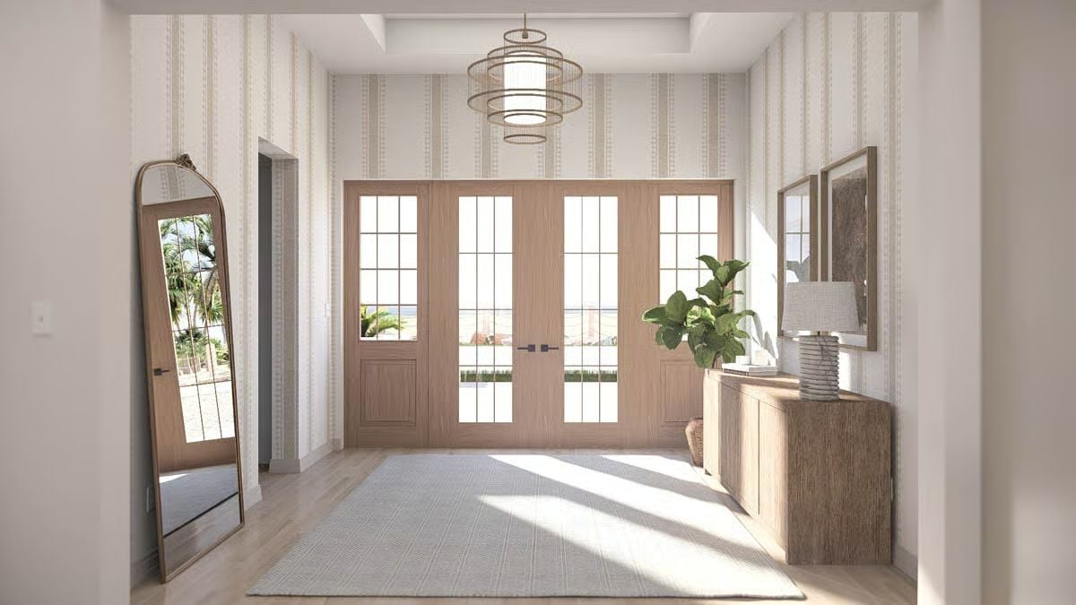 Warm Wood Tones and Stripe Wallpaper Set the Tone in This Coastal Foyer