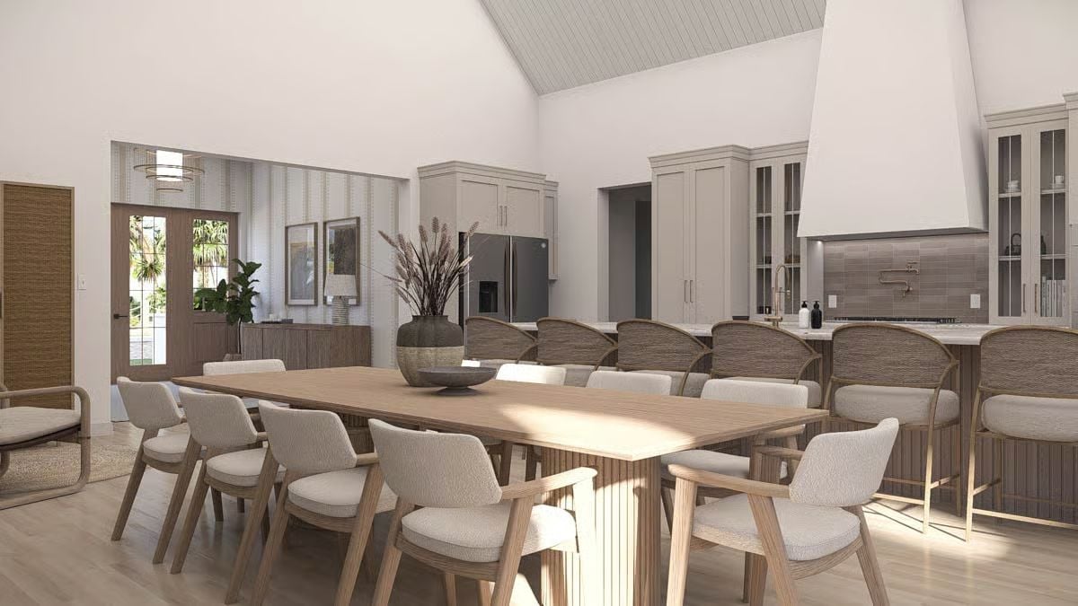 Reeded Table Legs and Rattan Chair Backs Anchor This Coastal Dining Room