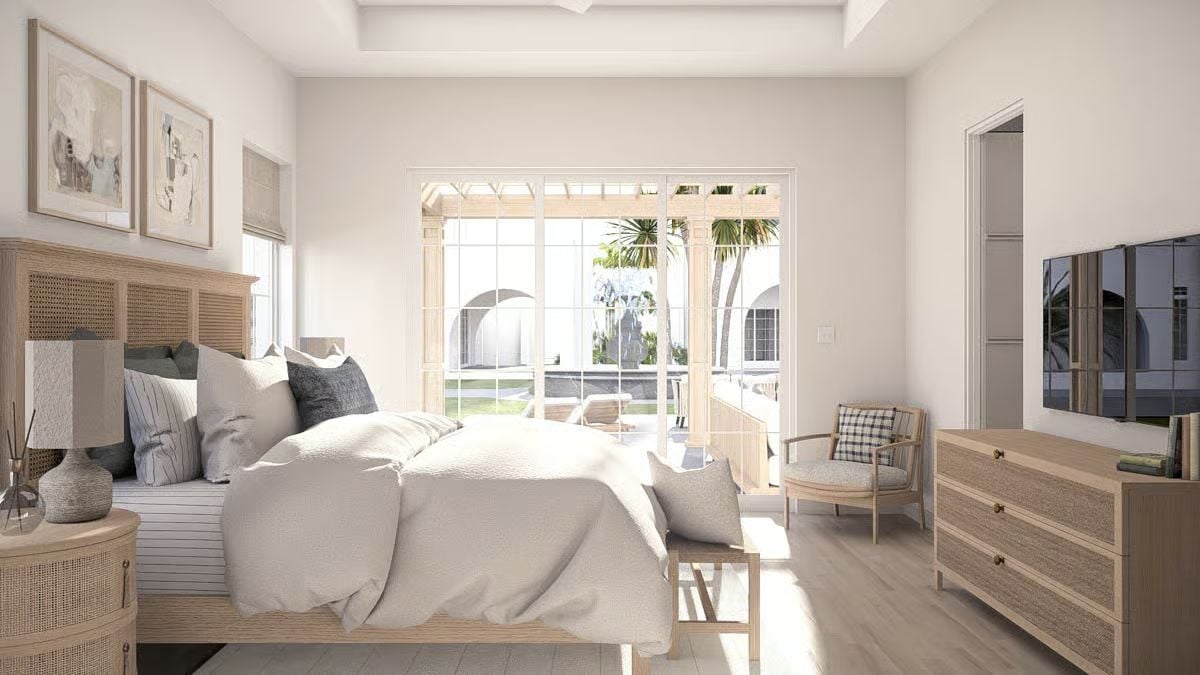 Rattan Headboard and French Doors Bring Coastal Character to This Primary Bedroom