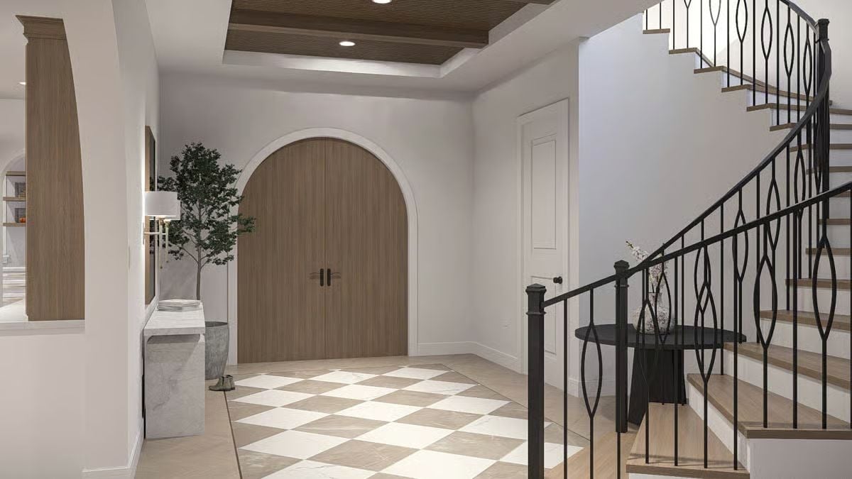Arched Double Doors Anchor a Foyer Built Around Contrast and Craft