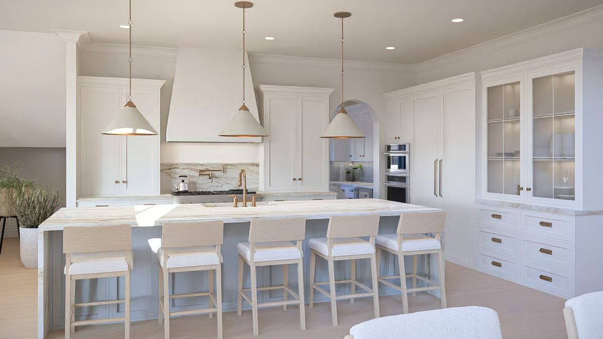 Gold Pendants and Marble Countertops Define This Kitchen's Coastal Palette