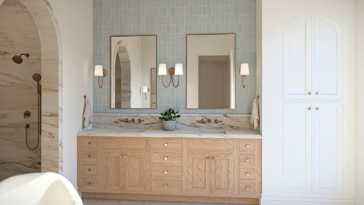 Sage Tile, Oak Cabinetry, and Brass Fixtures Shape a Double-Vanity Bath