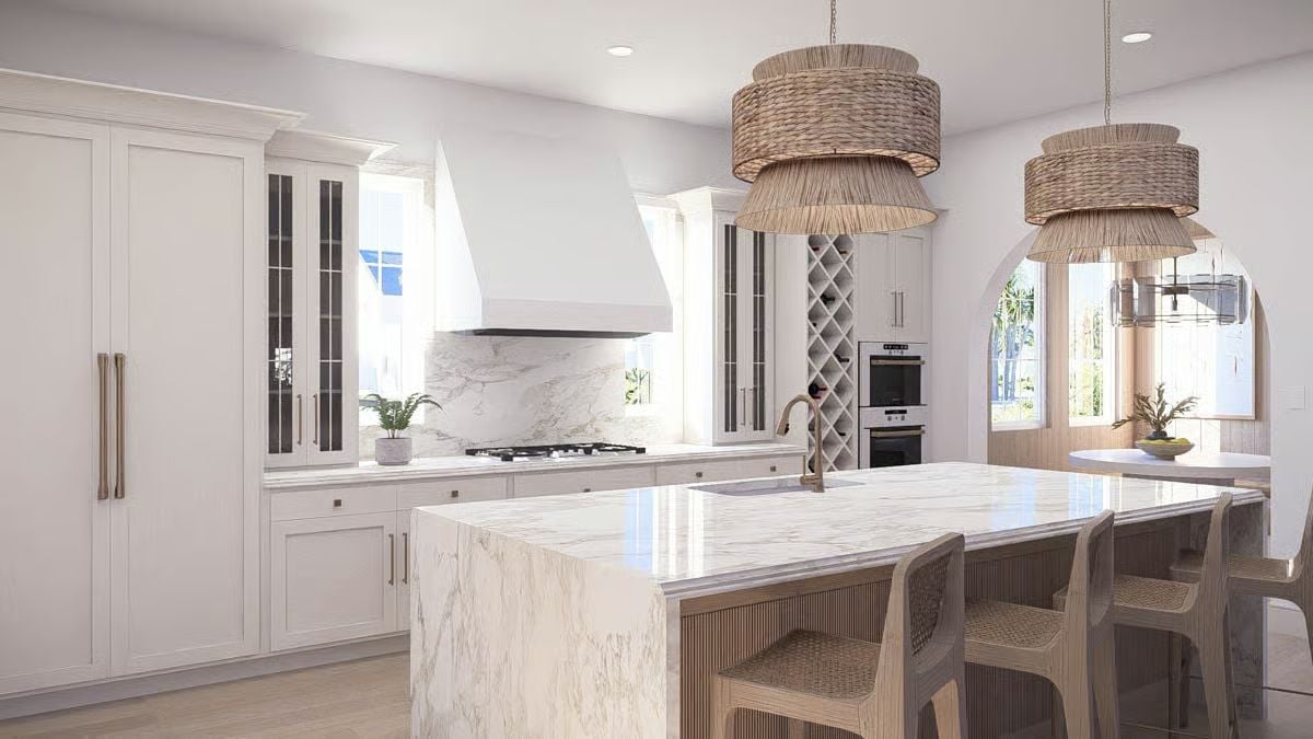 Woven Pendants and Marble Countertops Define This Coastal Kitchen