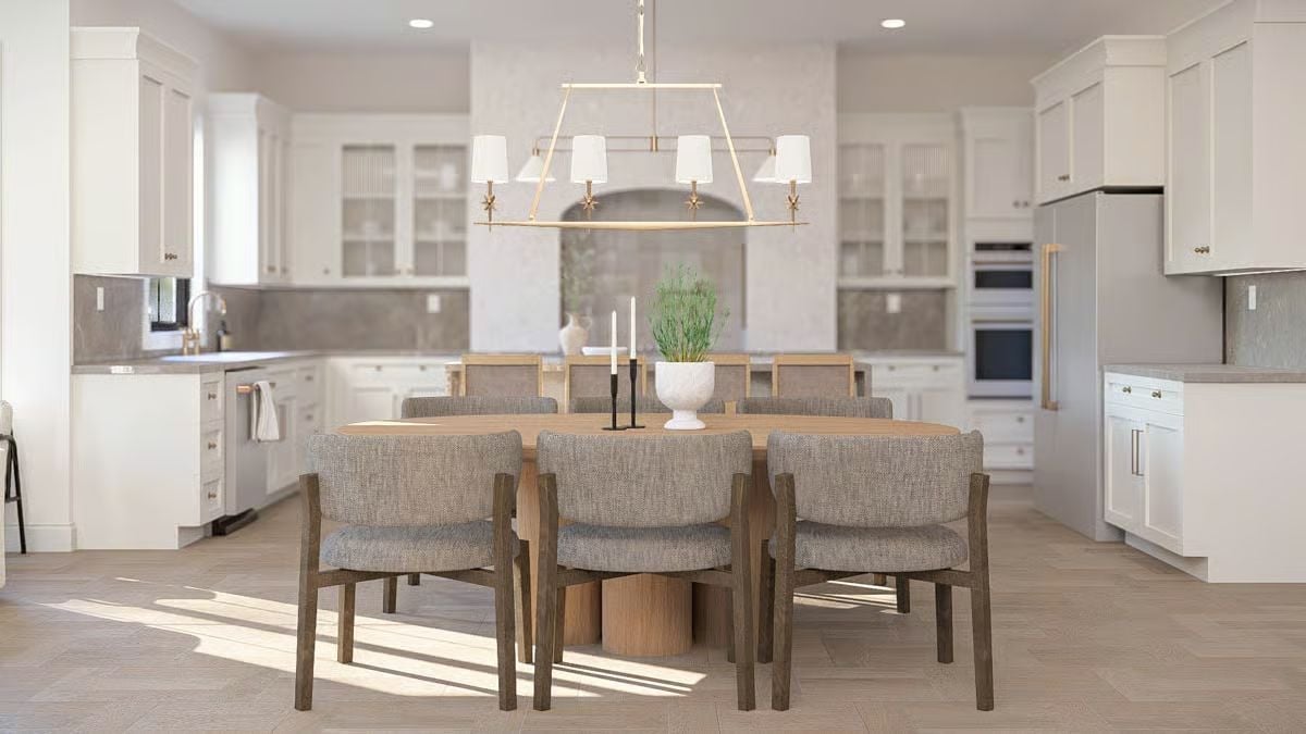 Gold-Frame Chandelier Anchors an Oval Table Built for Lingering