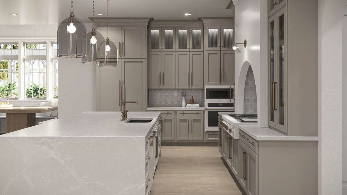 Sage Cabinets and Waterfall Quartz in a Coastal Kitchen