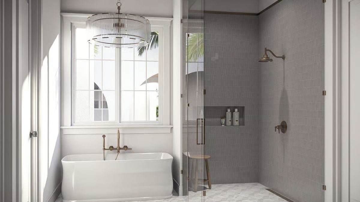 Brass Fixtures and Glass Walls Where the Tub Meets the Shower