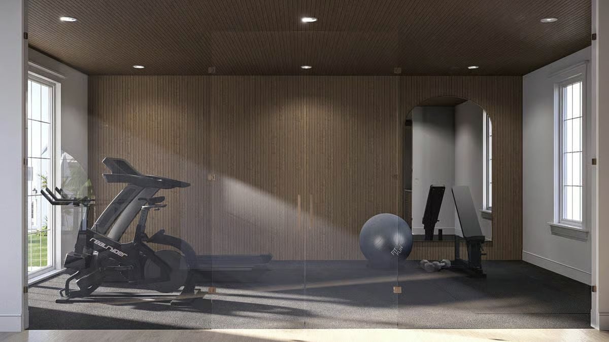 Slat-Wall Home Gym with a Spin Bike and Weight Bench Behind Glass