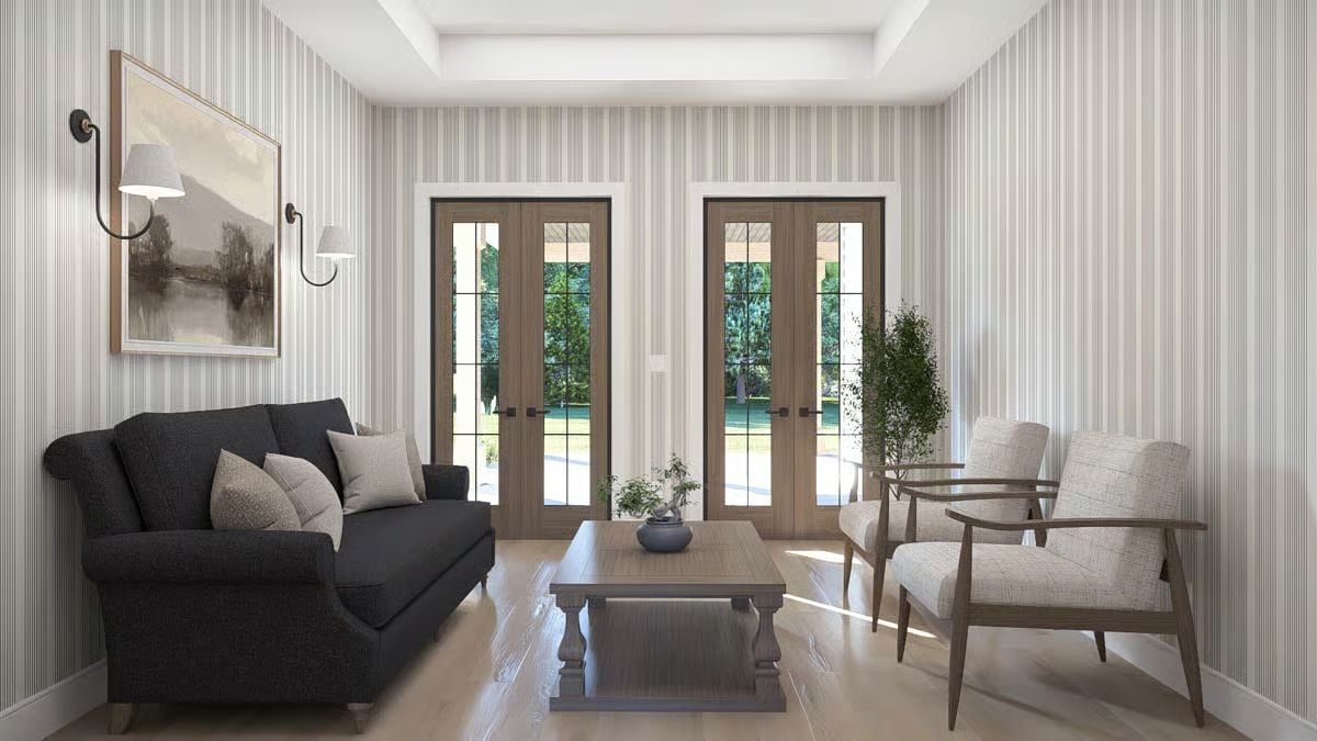 Striped Wallpaper and Black Upholstery Pull Off a Trick Most Rooms Can't