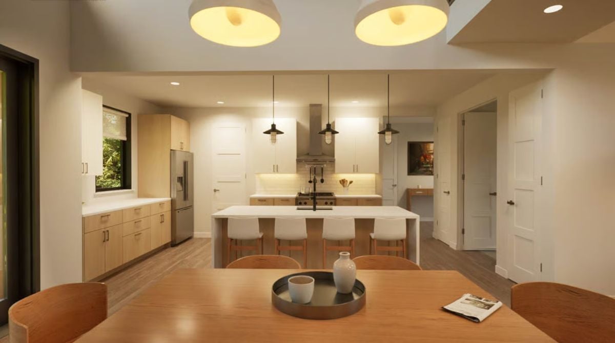 Warm Island Kitchen Where Natural Wood and White Cabinetry Share Equal Weight