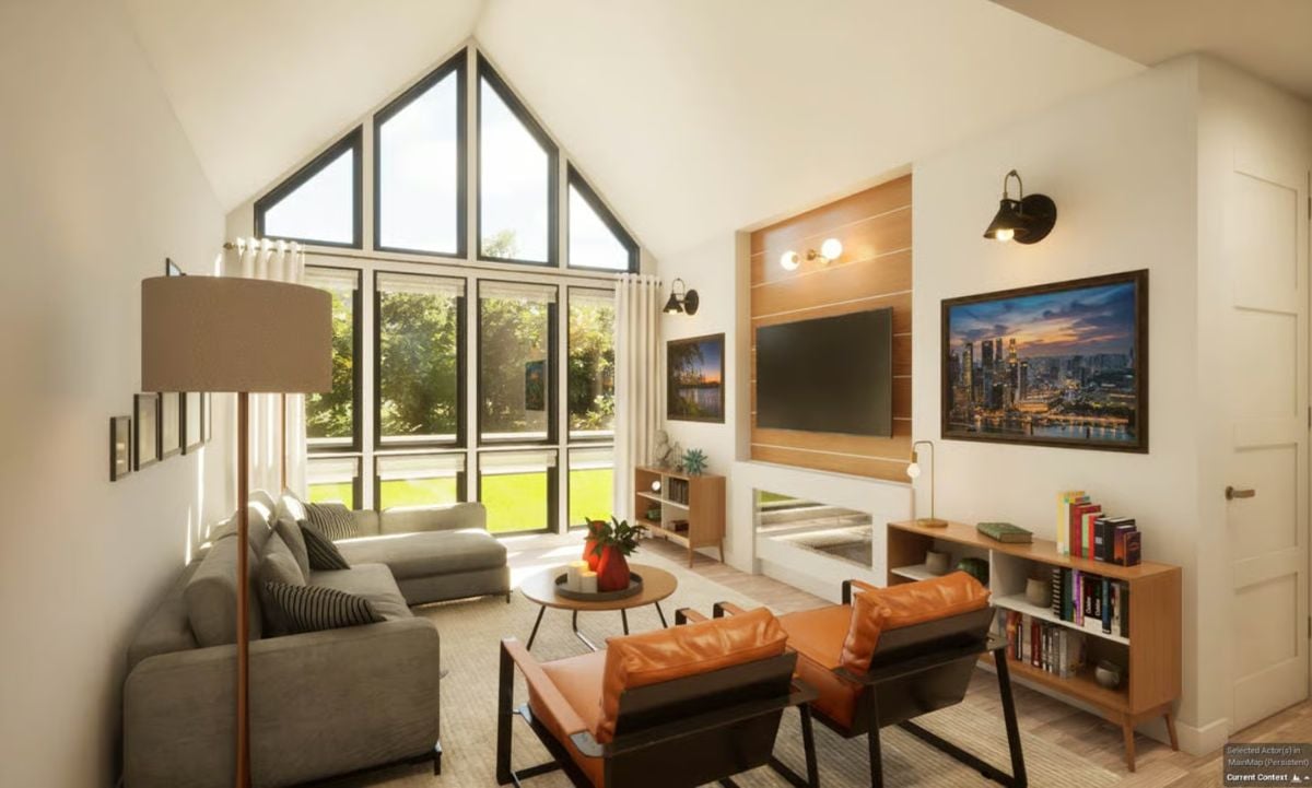 Vaulted Ceilings and Leather Chairs Anchor This Sun-Filled Living Room