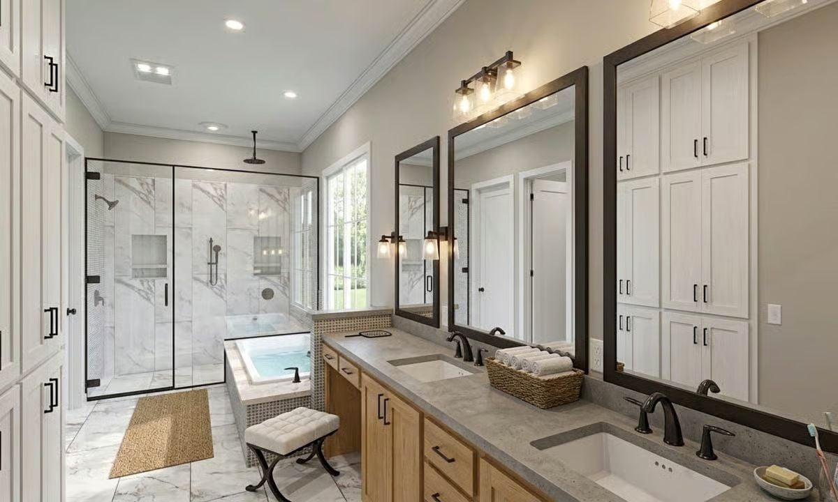 Marble Tile, Soaking Tub, and Bronze Fixtures Shape a Primary Bath Worth Lingering In