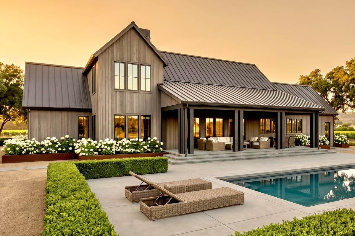 Weathered Wood Siding and a Standing-Seam Roof Set the Tone at Dusk