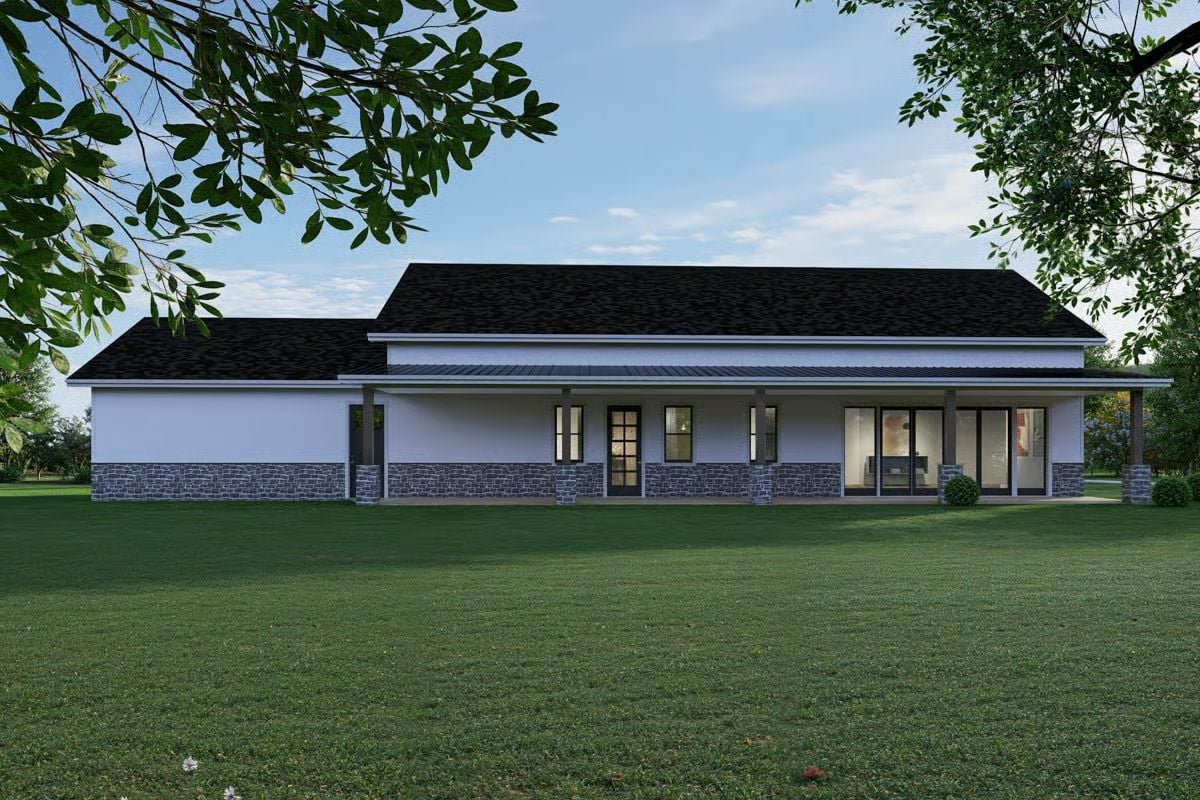 Covered Rear Porch Wraps a White Stucco and Stone Exterior