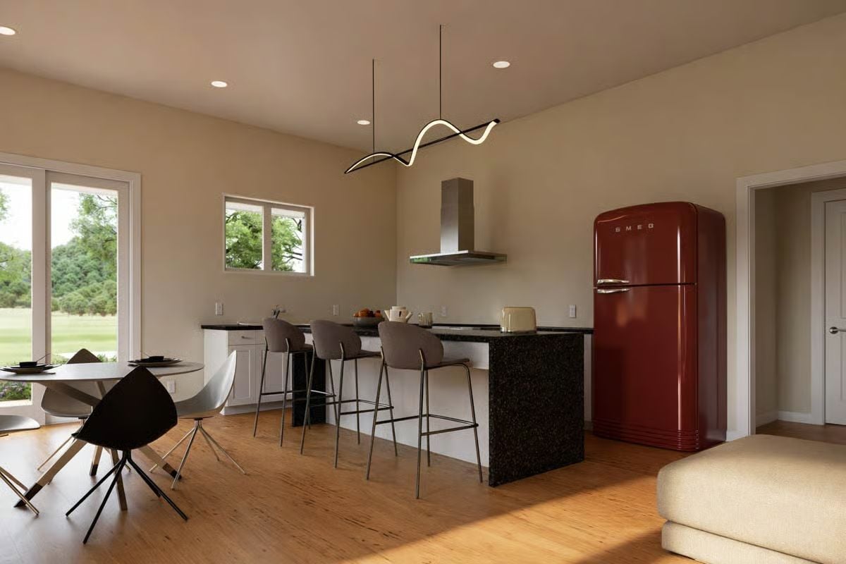 Red SMEG Refrigerator Commands Attention in an Open-Plan Kitchen