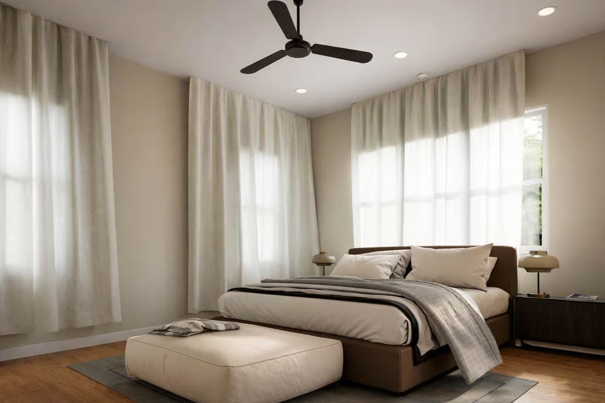 Sheer Curtains and Dark Wood Ground a Bedroom Built for Rest