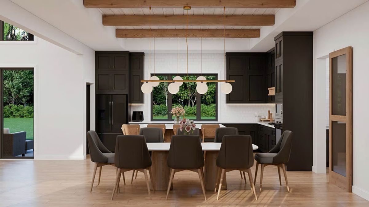 Exposed Ceiling Beams and Globe Pendants Anchor an Open Dining Space