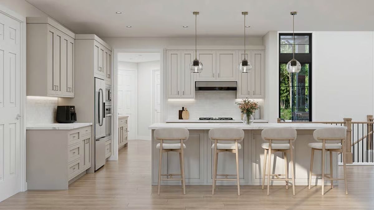 Warm Greige Cabinetry and Marble Counters Define a Kitchen Built for Everyday Living