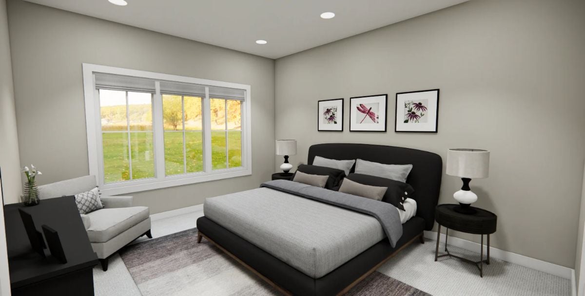 Dark Upholstery and Soft Gray Walls Make This Bedroom Feel Grounded
