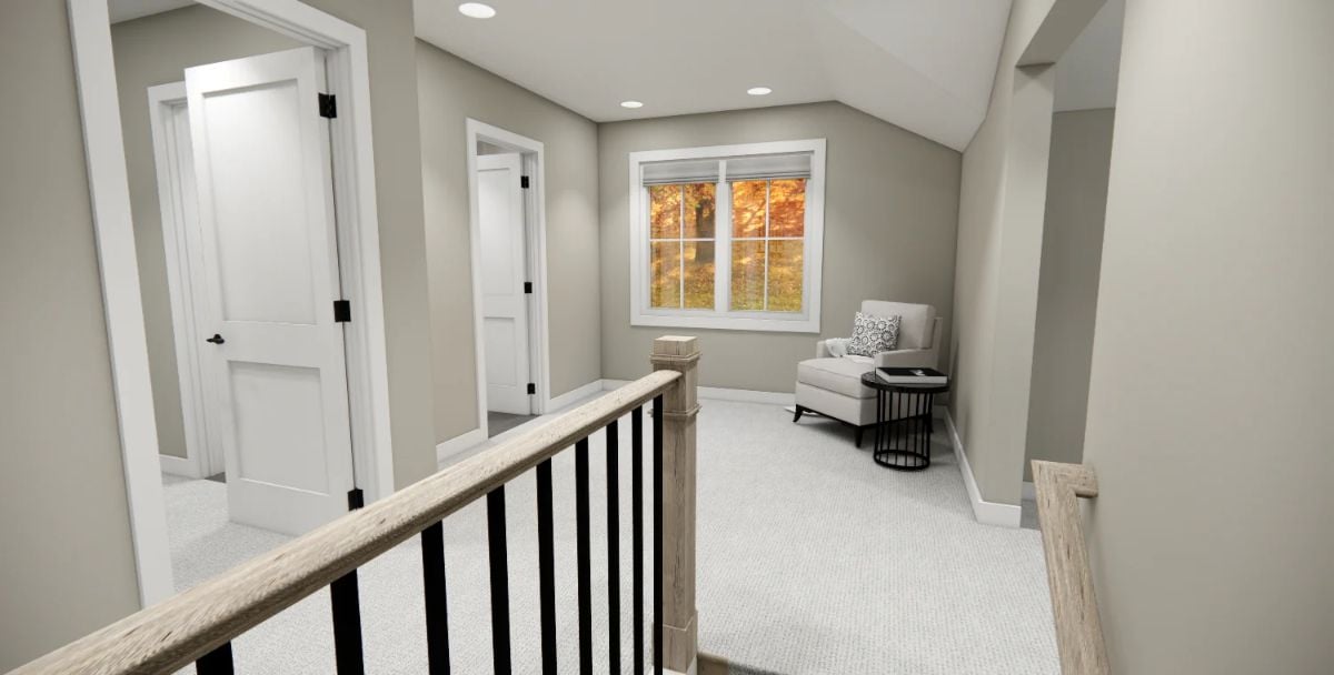 Loft Landing Carved Into the Roofline Earns Its Keep as a Sitting Area