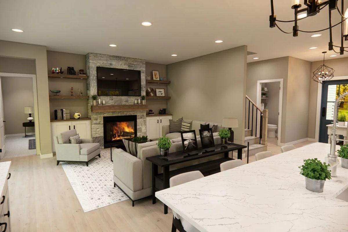 Stone Fireplace Anchors an Open Living Space Where Kitchen and Lounge Meet