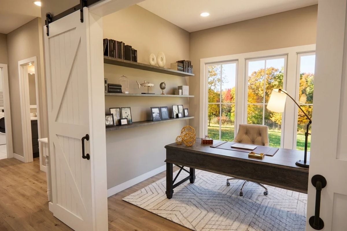 Barn Door Entry Frames a Home Office Built Around Natural Light