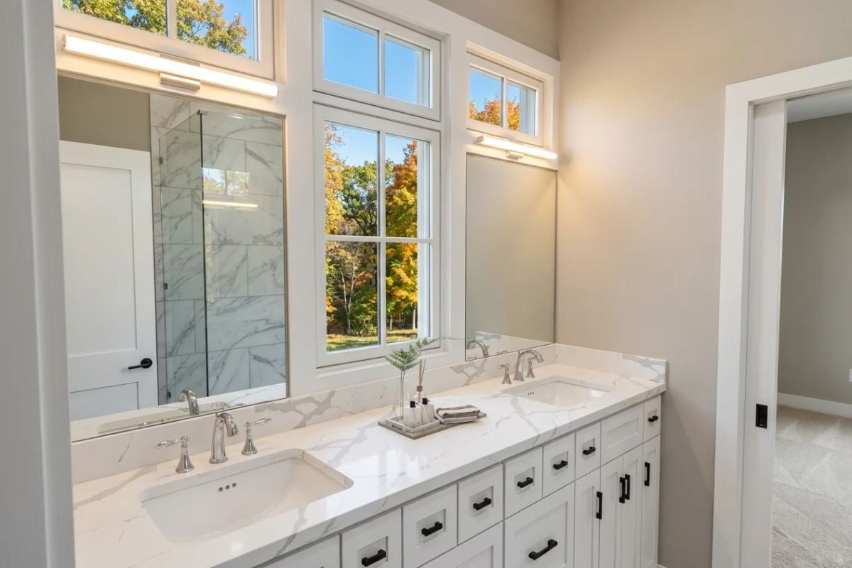 Marble Countertops and Black Hardware Define a Double Vanity Built to Last
