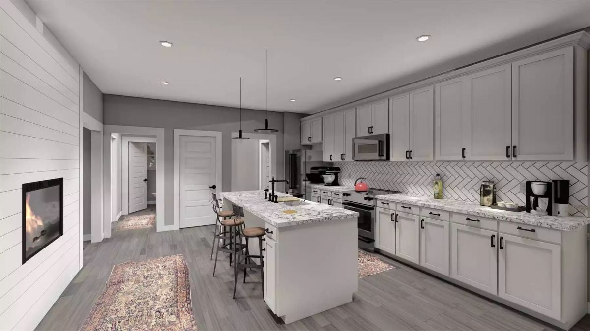 Marble Island and Herringbone Backsplash Define a Farmhouse Kitchen