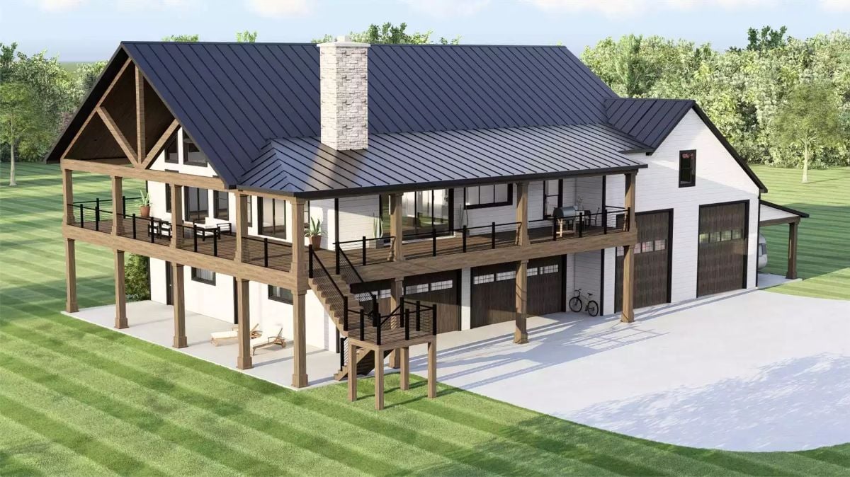 Wraparound Deck and Timber Frame Gables Define This Barndominium's Exterior