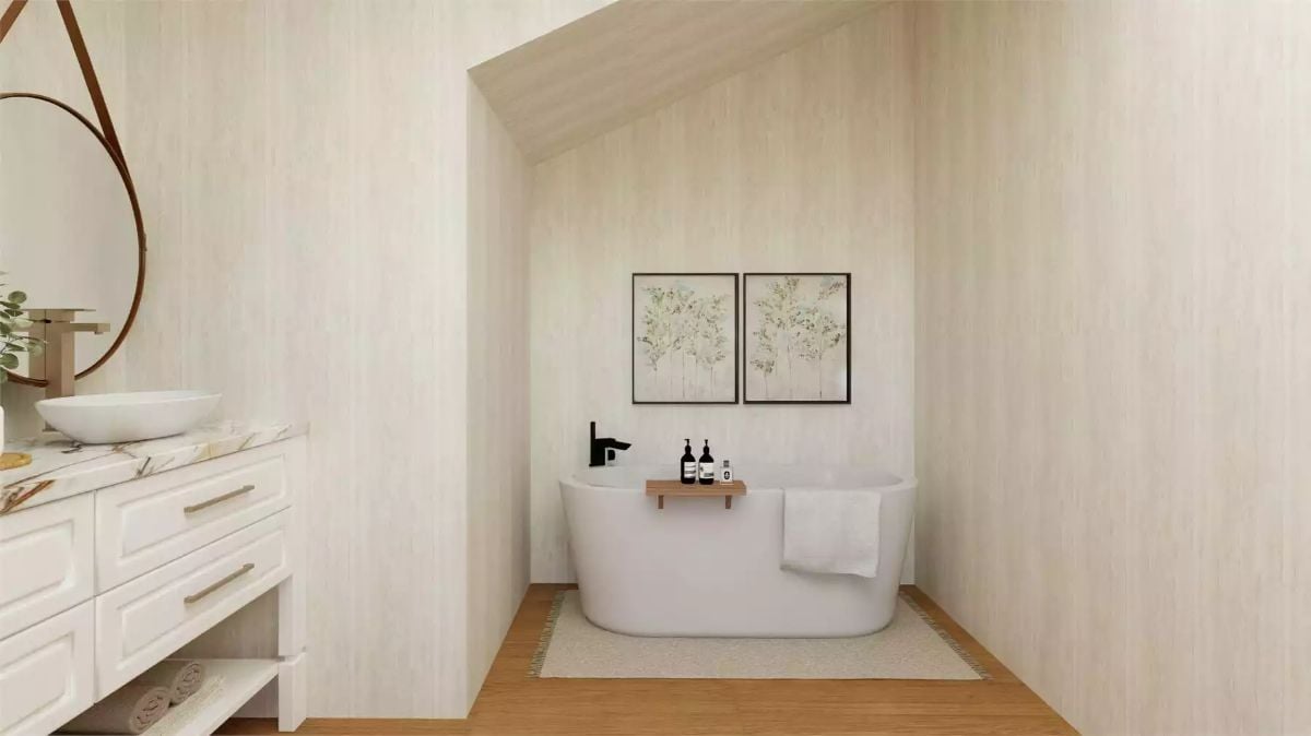 Freestanding Soaking Tub Anchors a Vaulted Alcove in Soft Neutral Tones