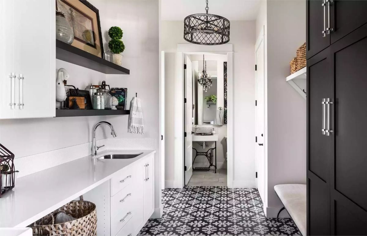 Patterned Floor Tile and Dual-Tone Cabinets Ground a Hardworking Laundry Hall