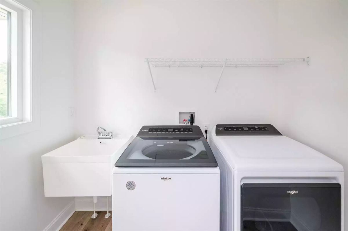 Whirlpool Top-Load Washer and Dryer Pair a Wall-Mounted Utility Sink