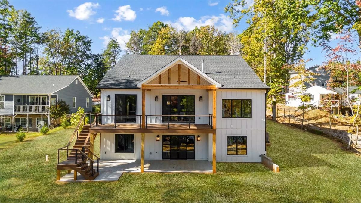 Covered Deck and Walkout Patio Define This Modern Farmhouse Rear Exterior