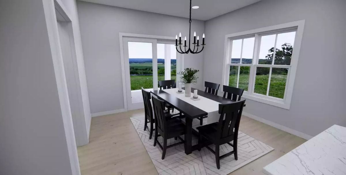 Candlelit Chandelier Anchors Dining Room Overlooking Open Fields