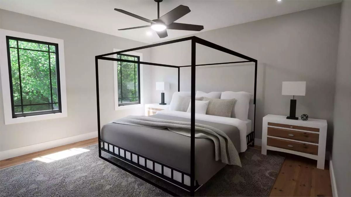 Four-Poster Iron Frame, Gray Linens, and Light That Earns Its Keep