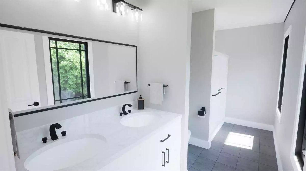 Matte Black Hardware Does a Lot of Heavy Lifting in an All-White Bath