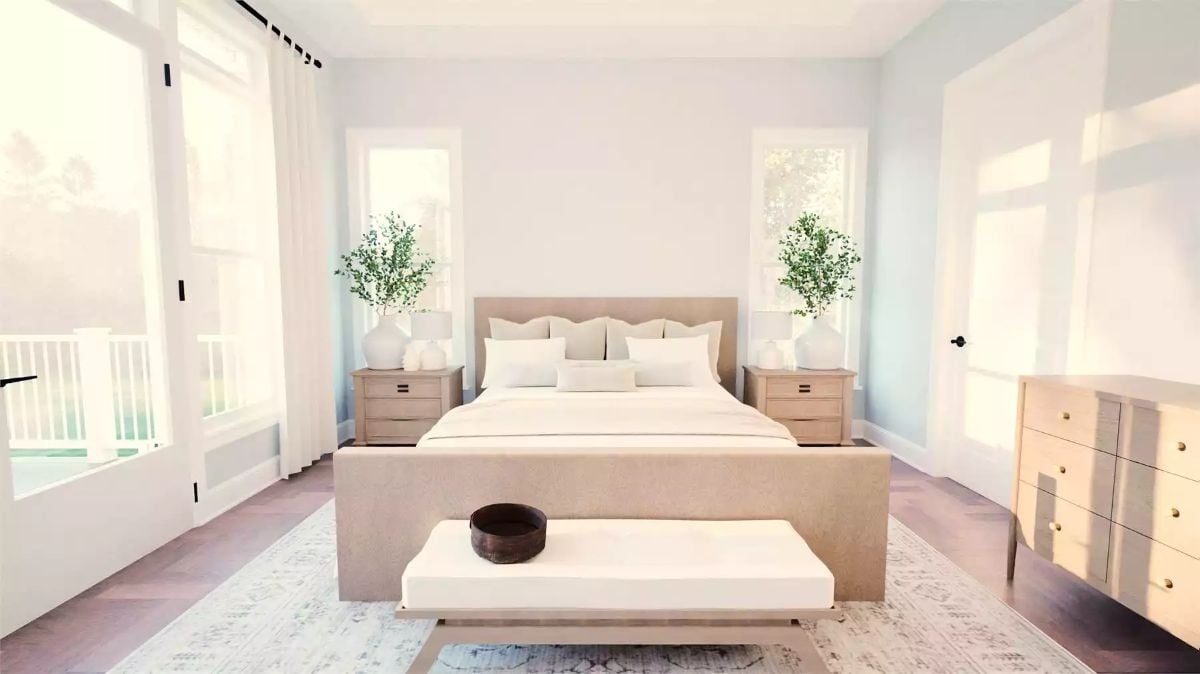 Warm Linen Upholstery and Paired Nightstand Greenery Define This Primary Bedroom