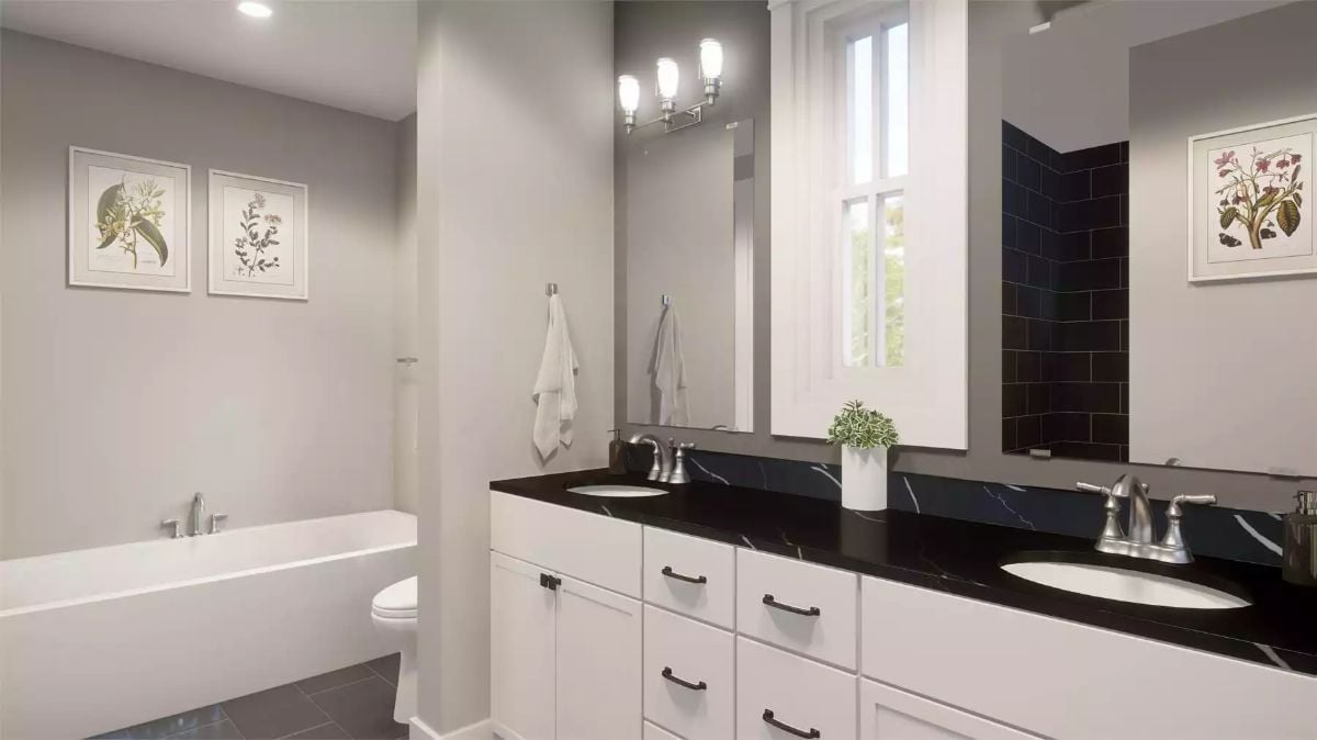 Black Marble Counters and Double Sinks Give This Bathroom a Polished Edge
