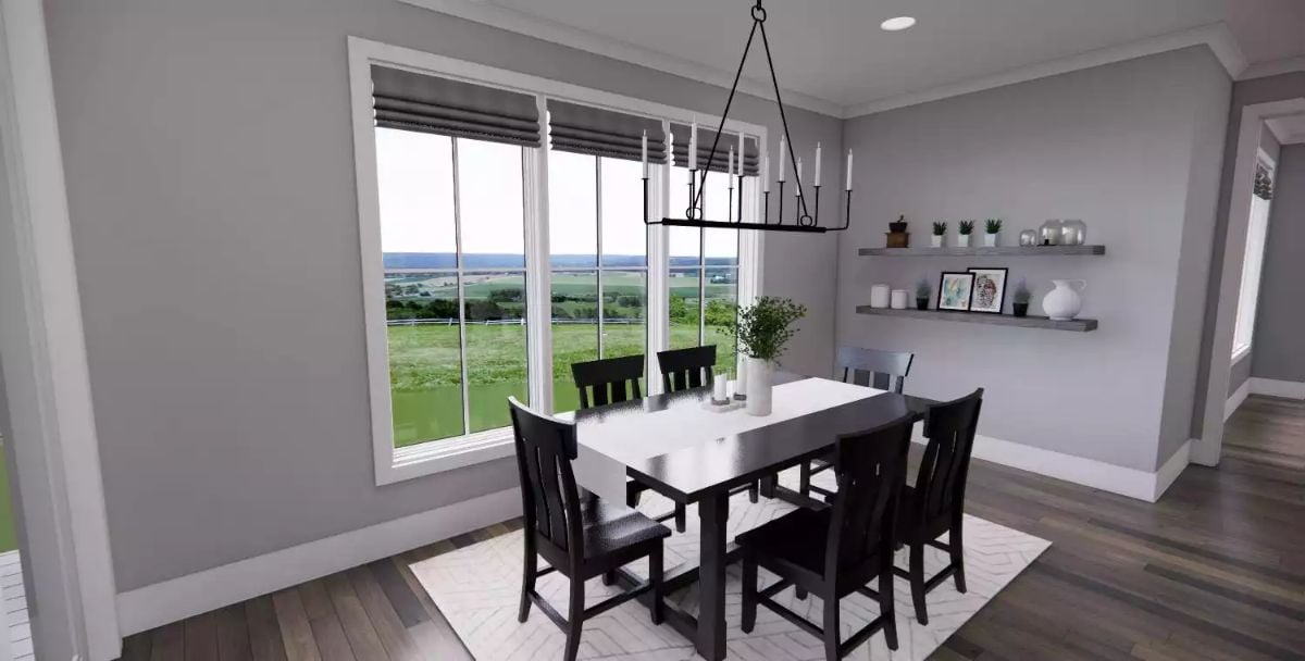 Candle-Style Chandelier and Countryside Views Define This Dining Room