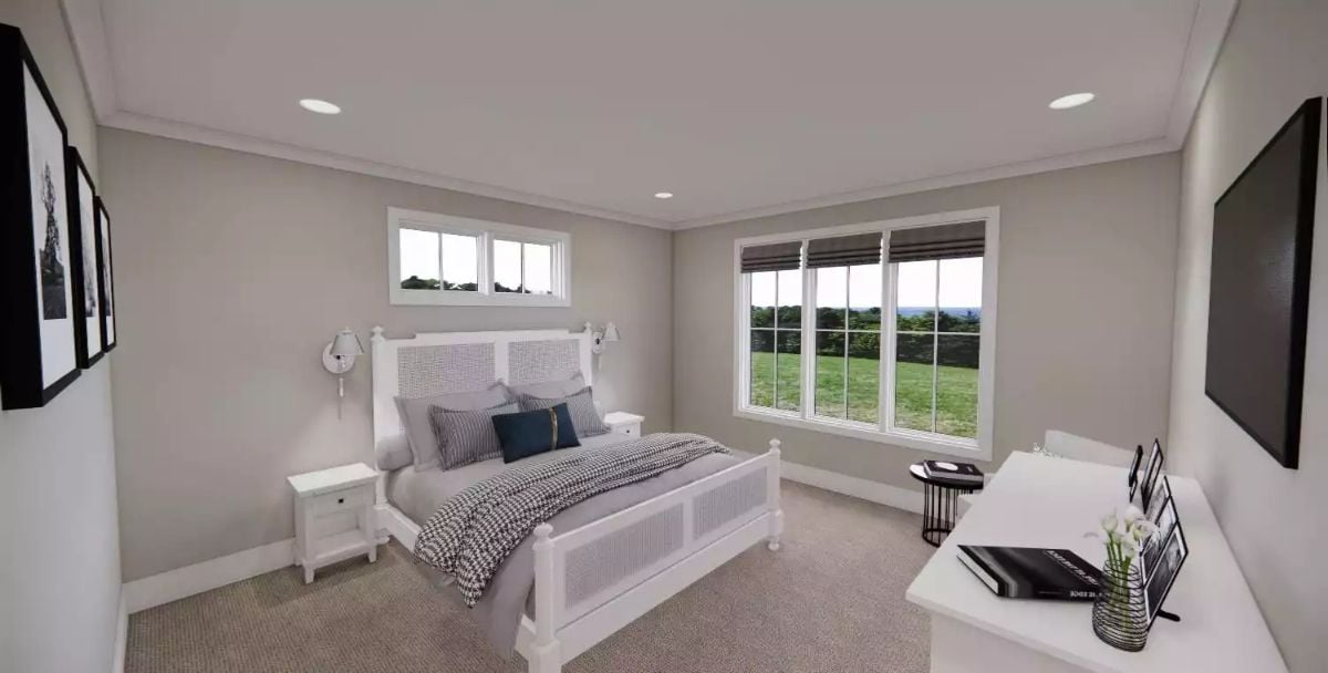 White Cane Bed Frame and Roman Shades Anchor This Carpet-Floored Bedroom