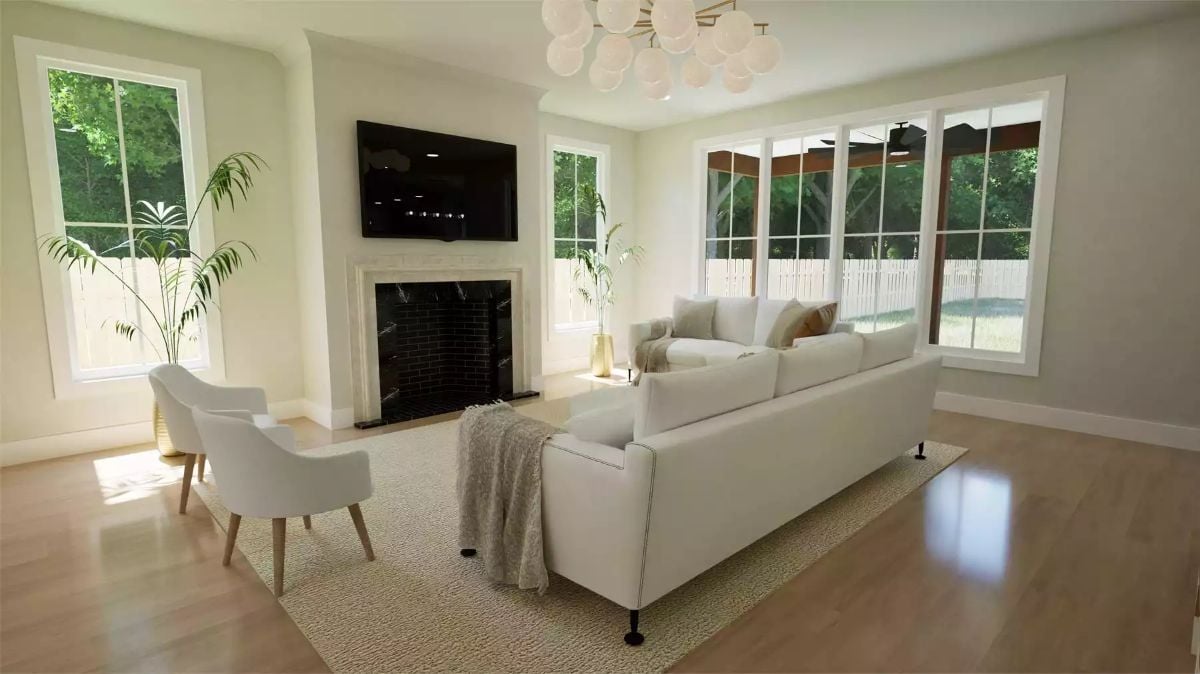 Marble Fireplace Surround and Globe Chandelier Anchor a Light-Filled Living Room