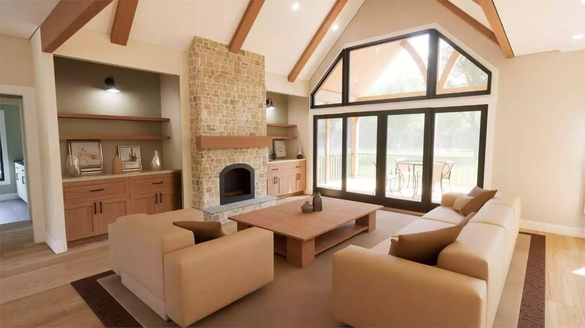 Vaulted Ceilings and Stone Fireplace Define the Heart of This Farmhouse Great Room