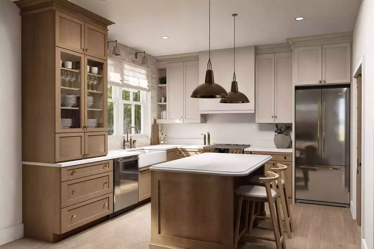 Warm Wood Tones and Brass Hardware Define an Open Kitchen Worth Cooking In