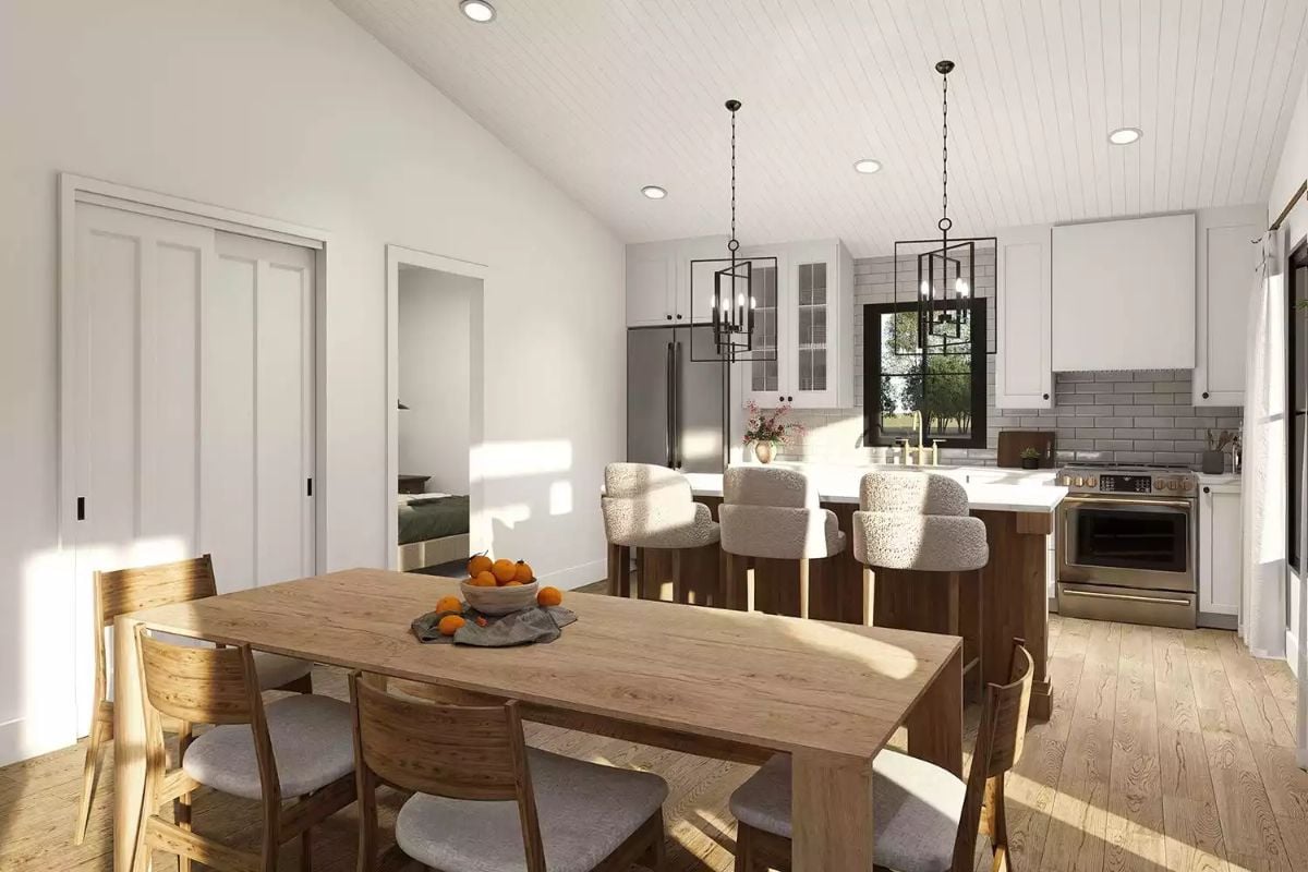 Warm-Toned Wood and White Cabinets Pull the Kitchen and Dining Room Together